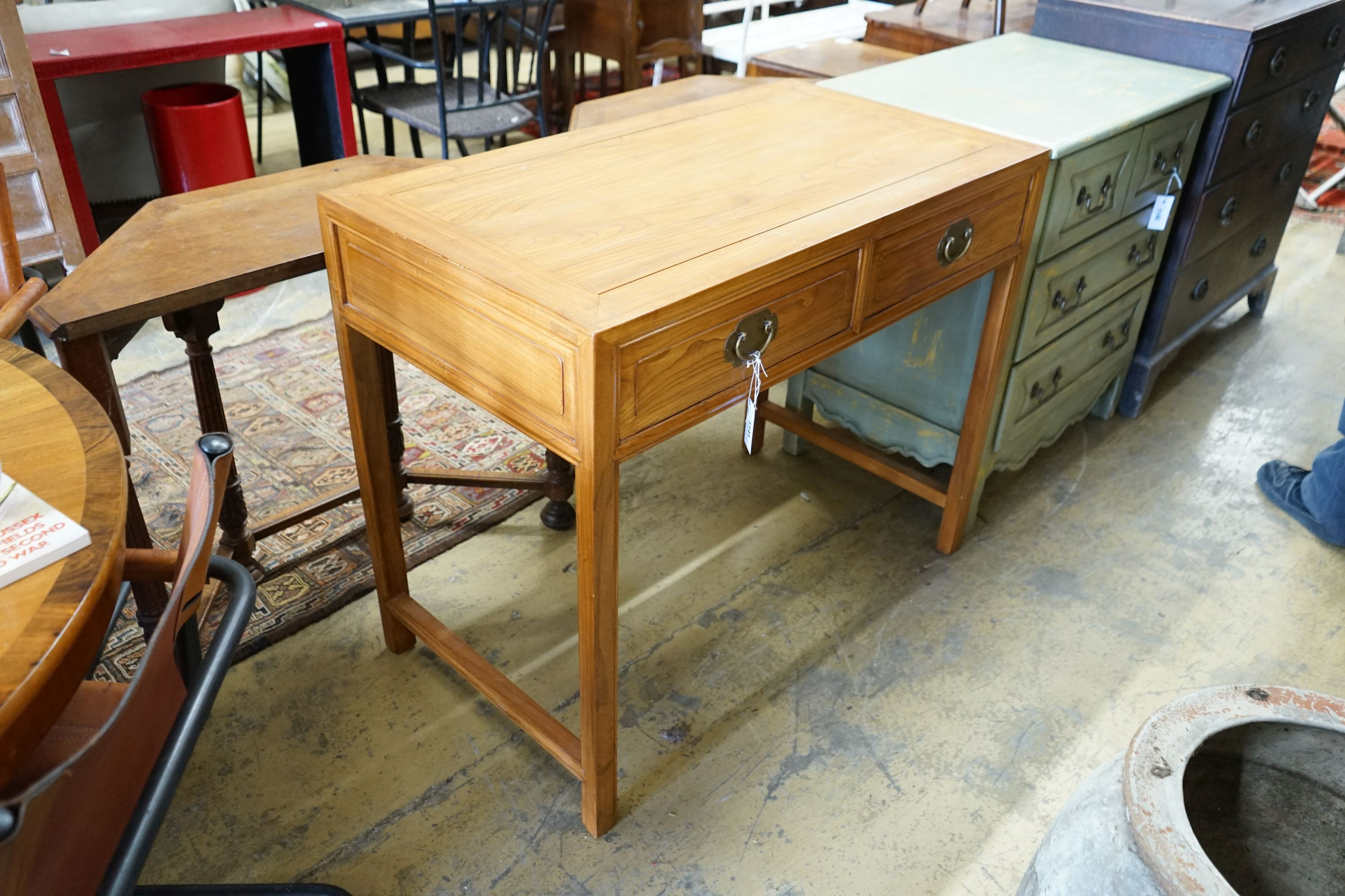 A Chinese elm two drawer side table, width 101cm depth 56cm height 84cm